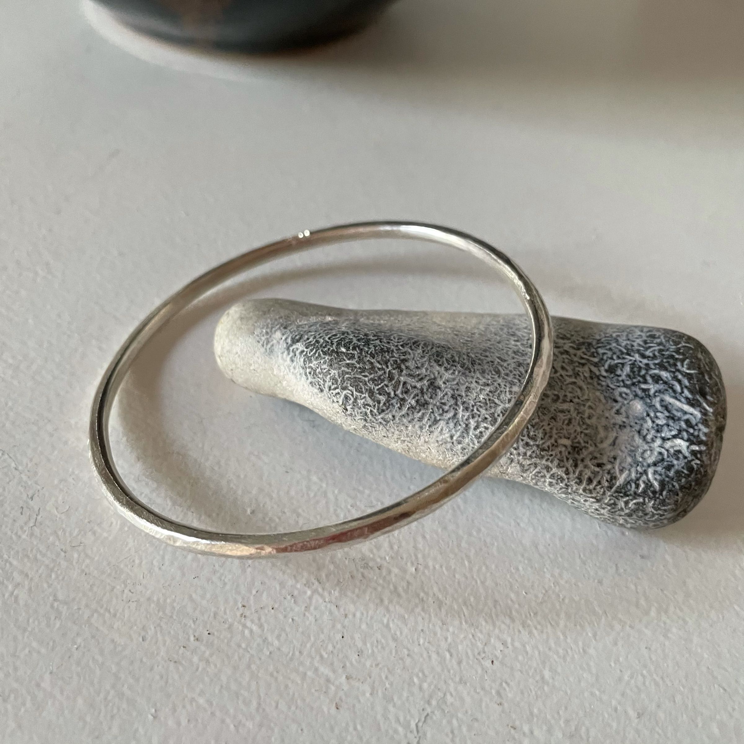Heavy textured rounded silver bracelet by Lucy Spink