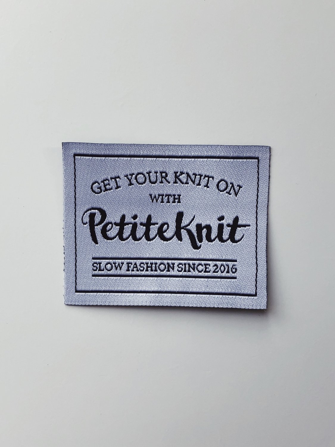 Label "Get your knit on with PetiteKnit"