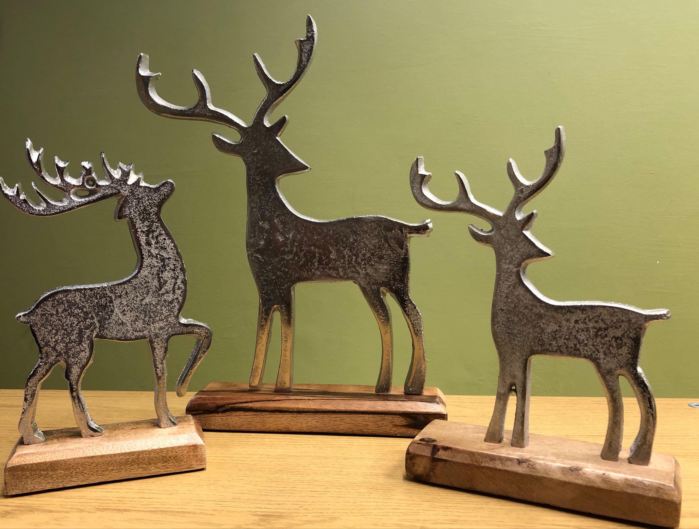 Metal stags on wooden base